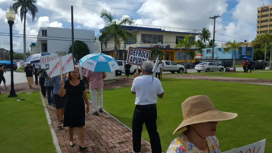 Protesting Catholics retire their signs
