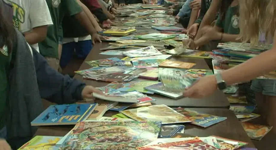 Miss Earth Guam Emma Mae Sheedy holds book drive