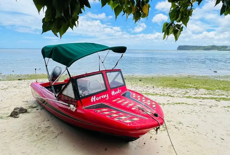 Abandoned red boat found in Tumon waters prompts investigation