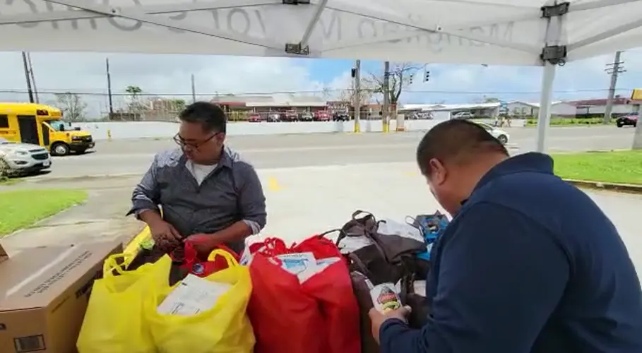 Mangilao mayor, staffers distribute food commodities to those in need