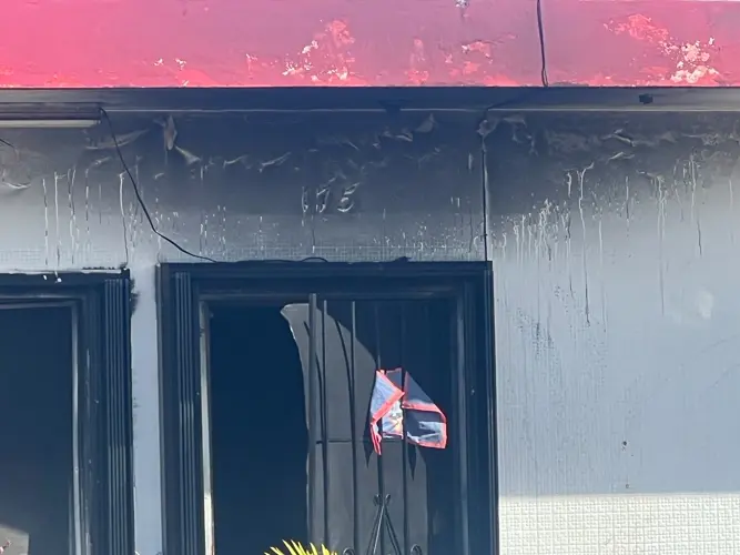 Early morning house fire sends woman to hospital