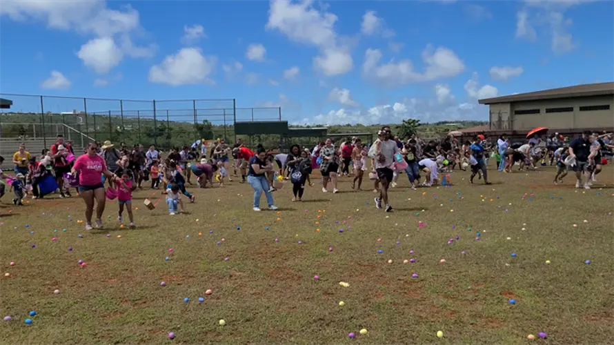 Hundreds of kids happily hunt for eggs at Easter Fair