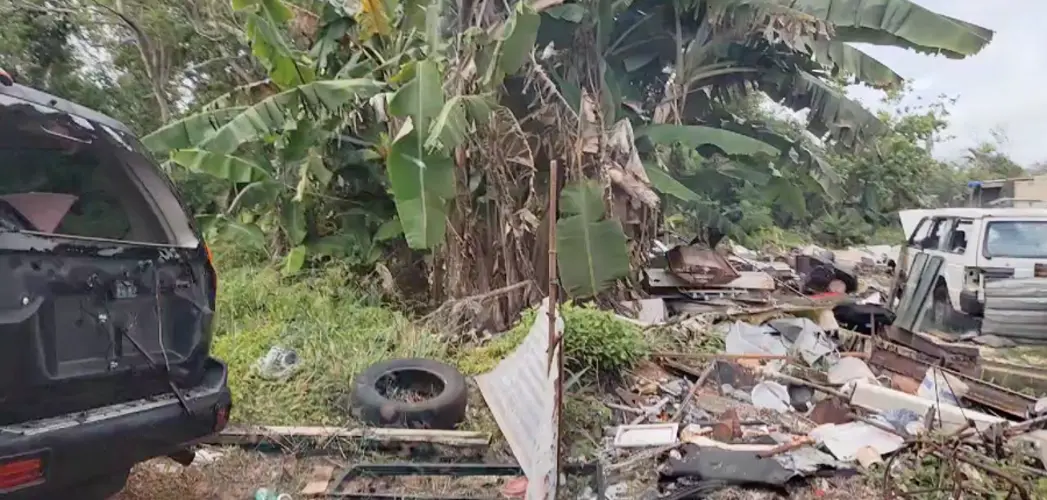 Junk cars littering CHamoru Land Trust property atop Aquifer