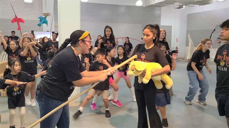 Ensemble cast of nearly 100 Guam kids performing The Lion King, Jr