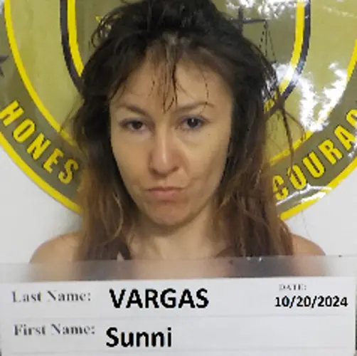 Woman attempting to walk away from police found with drugs