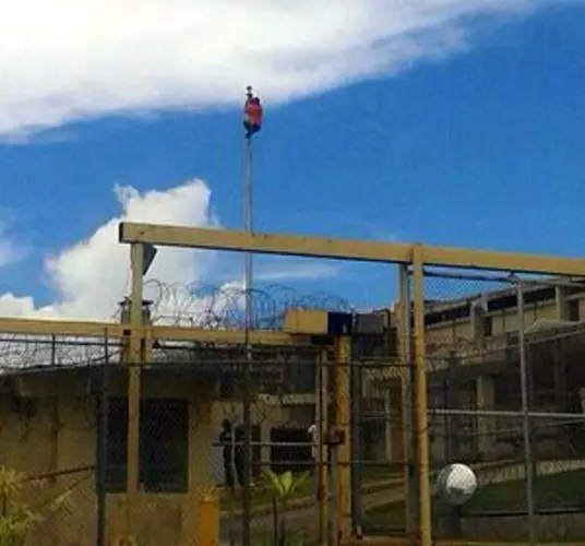 Inmate climbs to top of flagpole at prison
