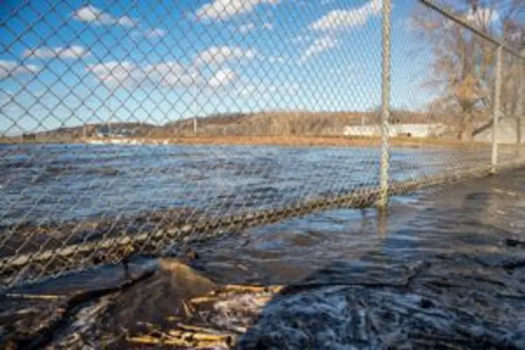 Residents scramble as floodwaters breach levees, prompt evacuations