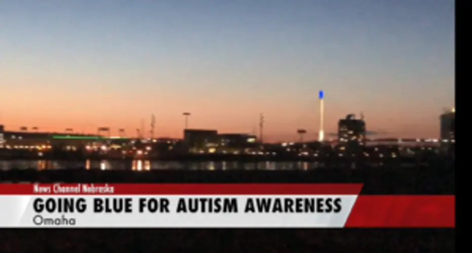 Bob Kerrey Pedestrian Bridge lit up blue for autism awareness