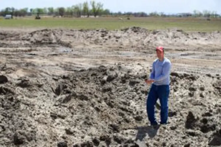 'Mountain of sand' covers some Nebraska farms after floods, adding pains to planting season