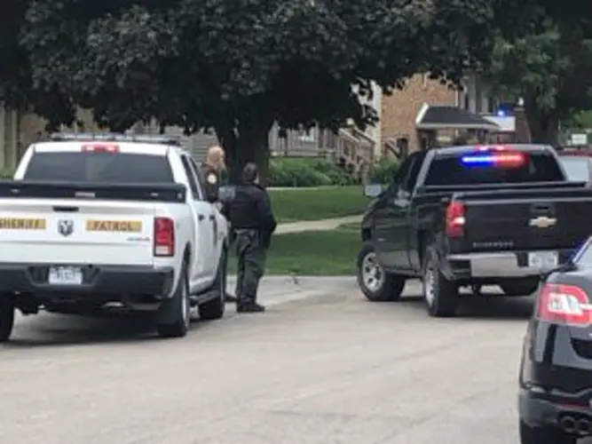 Police have home surrounded after downtown shooting