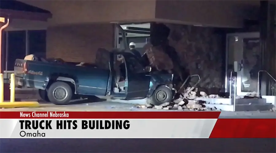 Pickup plows into Omaha building