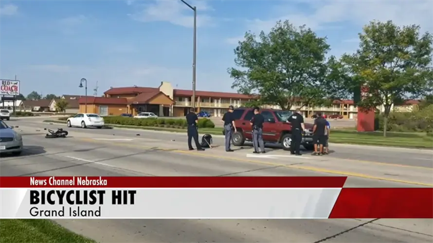 Two injured after car hits bike in Grand Island