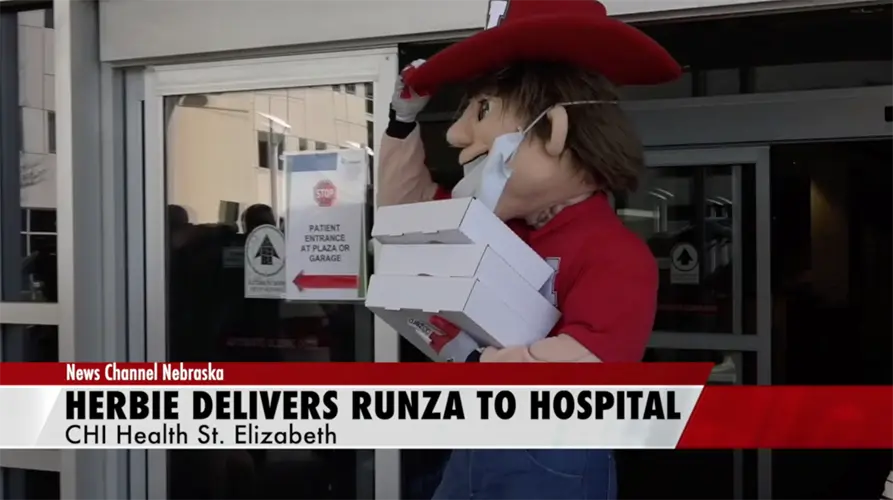 Herbie Husker delivers Runza to hospital staff