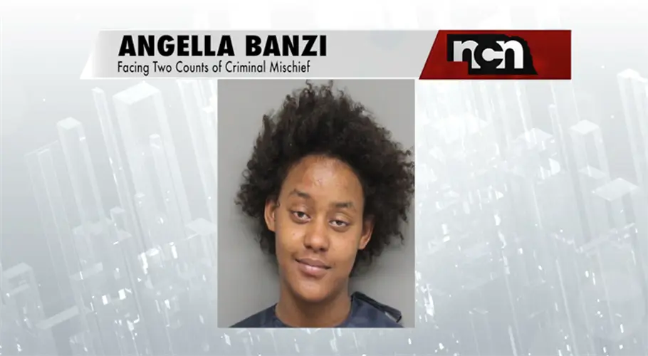 Woman arrested after kicking and smashing glass panes of apartment building's elevator