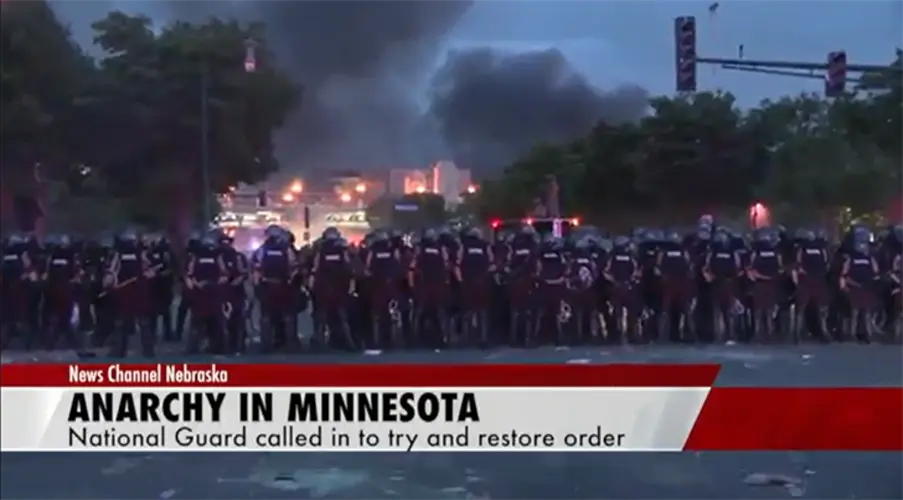 George Floyd - Line of police move through street