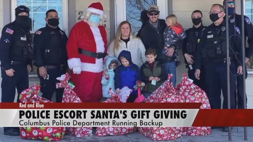 Santa cop delivers presents amid police presence
