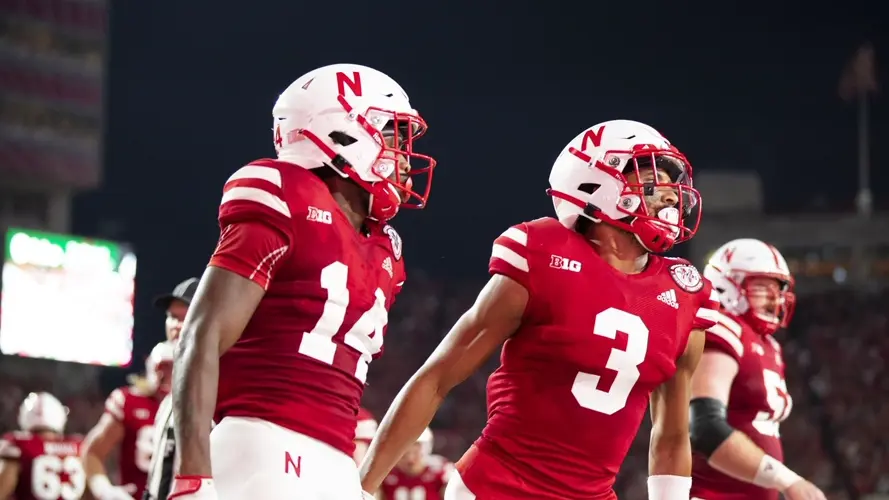 Huskers bit late by No. 9 Wolverines