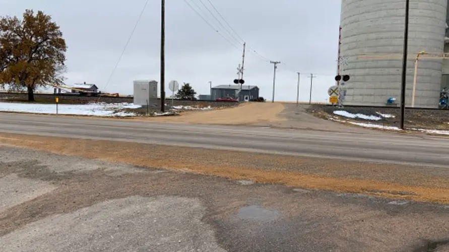 Grain truck loses load in Gurley when hopper hits railroad tracks