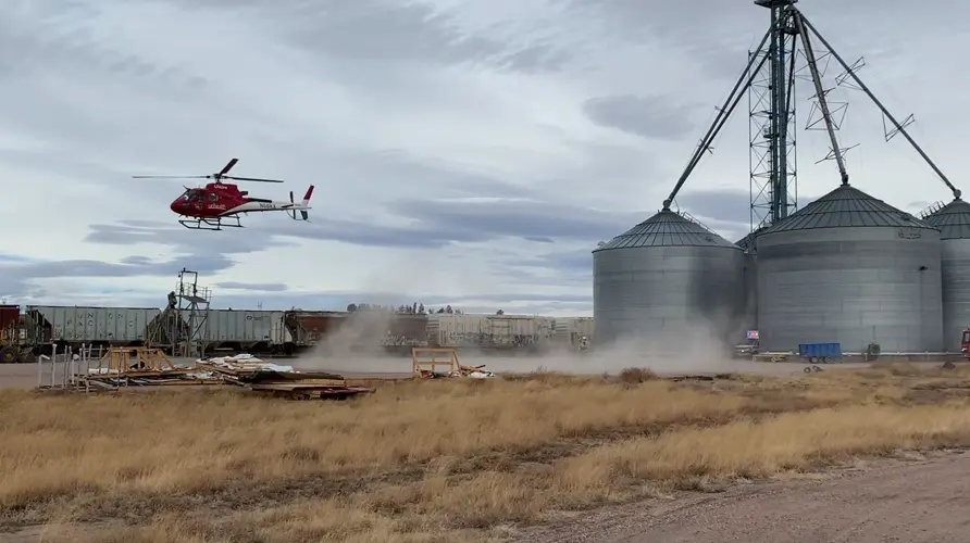 Emergency response officials surround grain bins at Pennington Seed