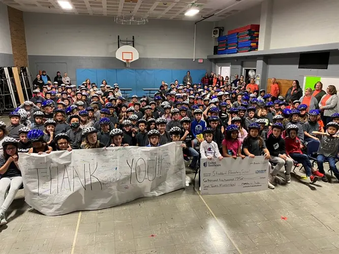 Stoddard Elementary students all get free helmets through UnitedHealthcare, NCN program