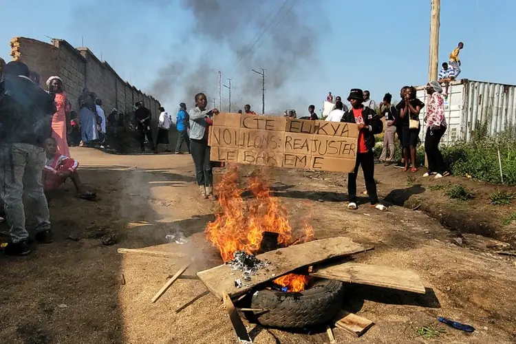 WHO chief visits Congo to support Ebola efforts as some workers strike over pay