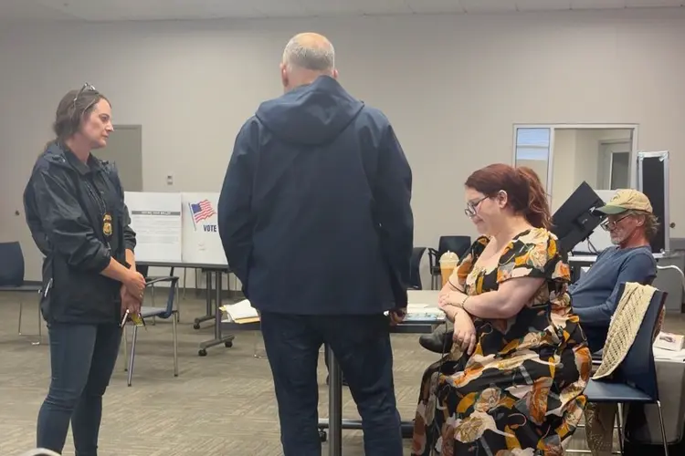 Election worker says federal officers confronted her at polls over social media post criticizing ICE