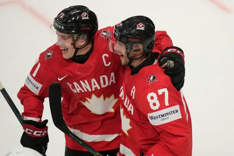 Celebrini and Crosby score as Canada beats US to advance to semifinals of ice hockey worlds