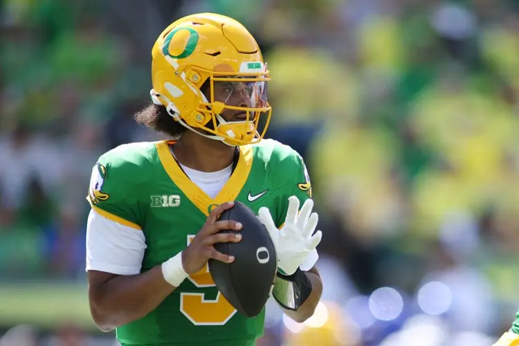 Moore throws for 3 TDs and No. 2 Oregon overcomes a slow start to beat Boise State 34-27