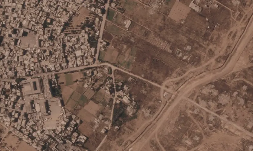 Israel is building a miles-long earthen barrier inside Gaza, entrenching its division