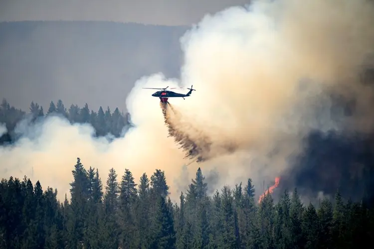 Oregon firefighters brace for windy and hot weather as they battle dozens of blazes