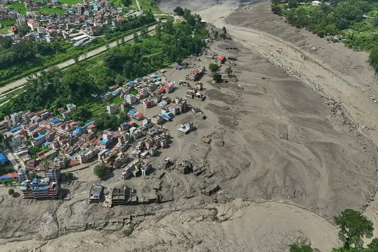 Hundreds missing and at least 8 killed after avalanche triggers deadly flash floods in Nepal