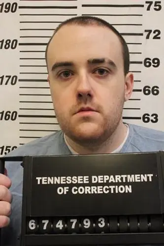 Man serving a life sentence for murder slips through a fence and escapes a Tennessee prison