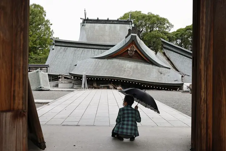 Death toll rises to 13 as rescuers search for the missing after Japan earthquake