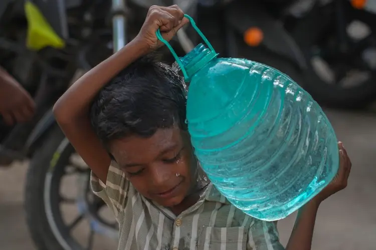 Delayed rains bring water shortages to cities and uncertainty to farms across India