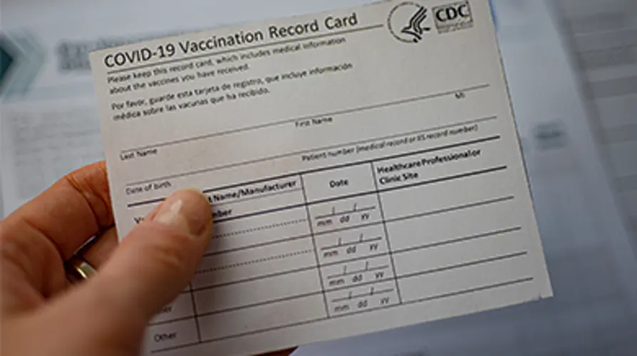 Grand Island man charged with possessing fake vaccine card