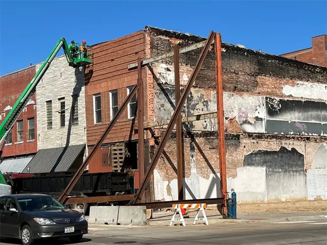 Facade removal underway in Hastings for building next to former Bert's Pharmacy