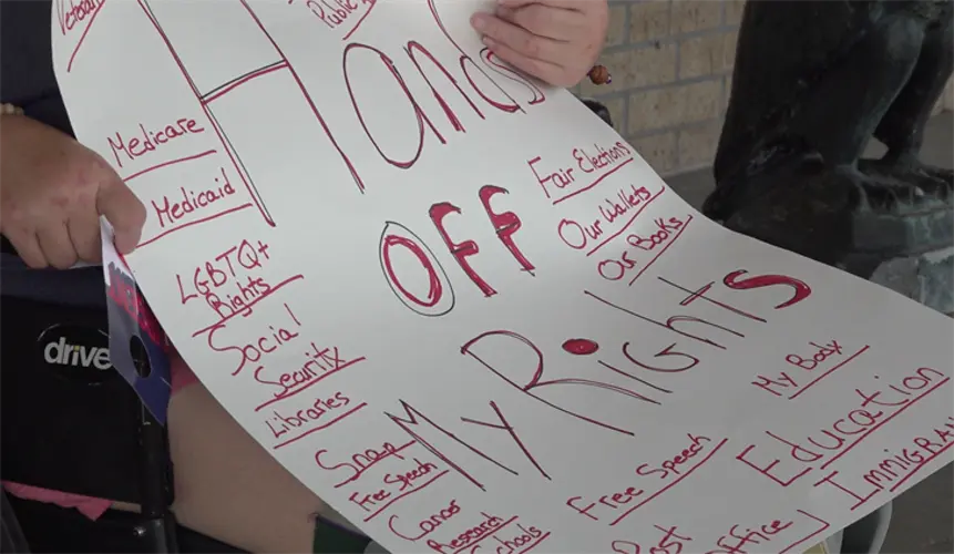 Protesters gather at Senator Pete Ricketts' Kearney office
