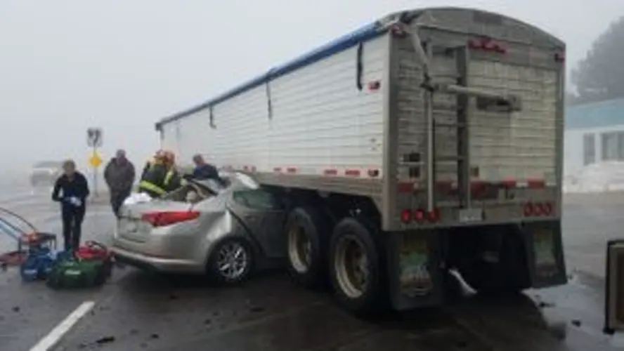 Car, Semitrailer Truck Collide on Fogbound U.S. 77