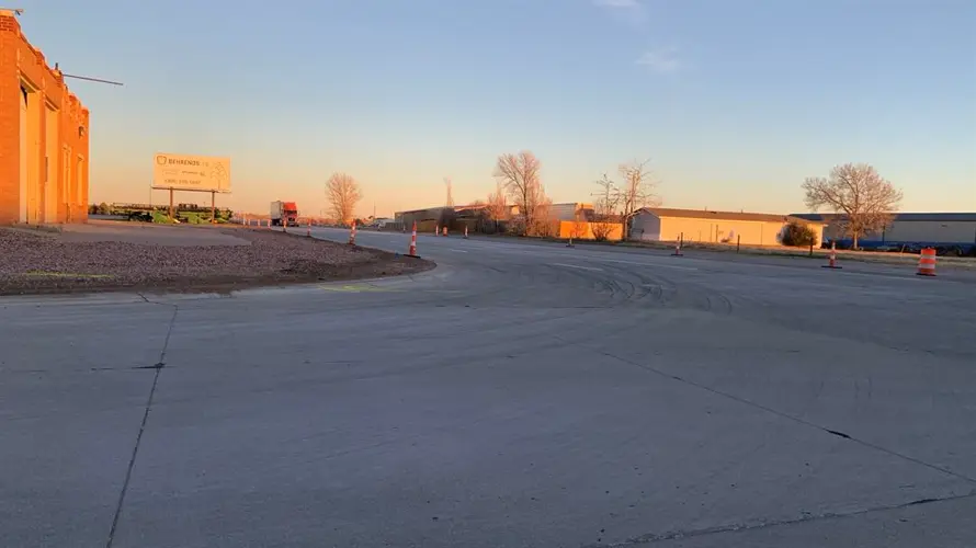 Truck enters construction zone, drives in wet cement