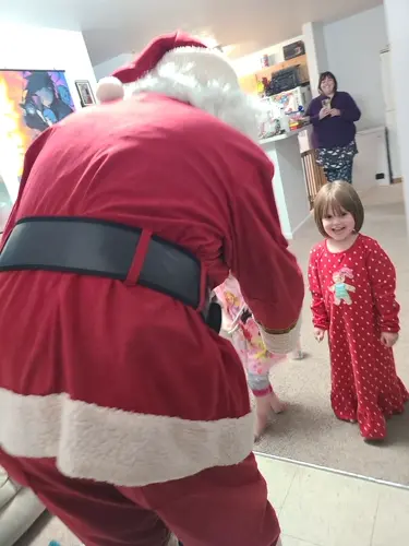Sidney Volunteer Fire Department escorts Santa to family homes