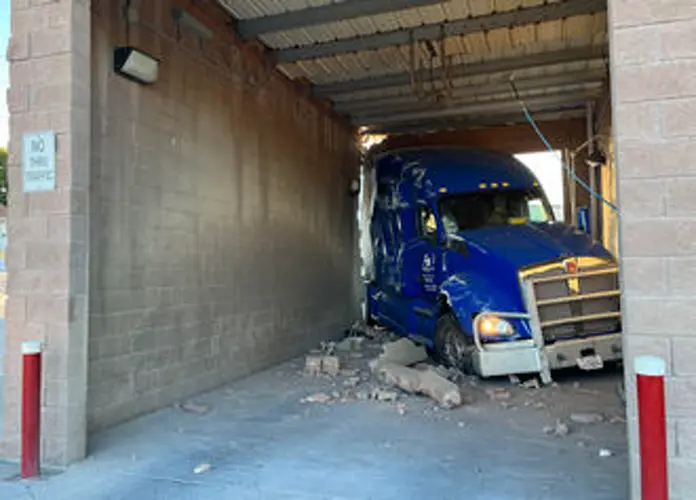 Semi rolls across two Chadron streets, hits truck and car wash