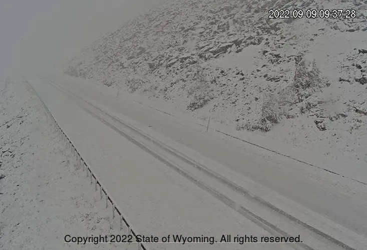 Snow plows clearing roads in northern Wyoming