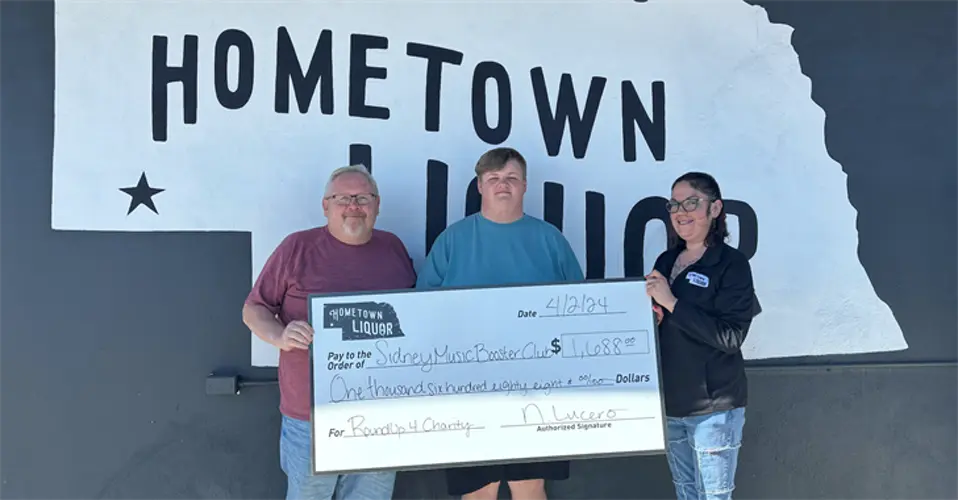 Hometown Liquor, customers, show support for Sidney Raiders Music Booster Club