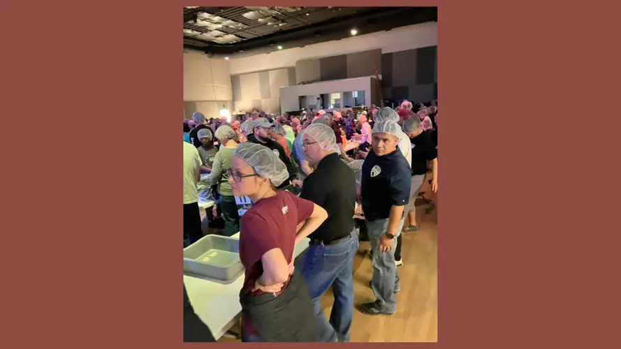 Columbus Police, Fire Departments pack meals for children in Haiti
