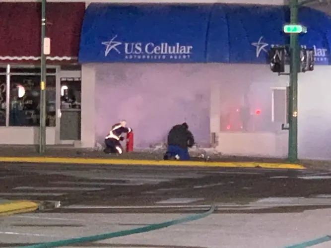 Dozens evacuated after car crashes into store, hits natural gas line
