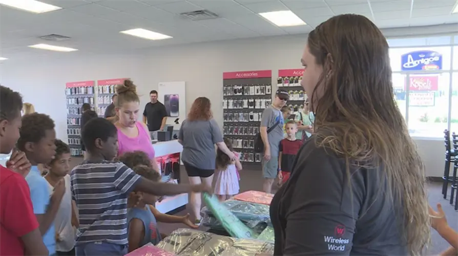Midwestern phone carrier company hosts backpack giveaway