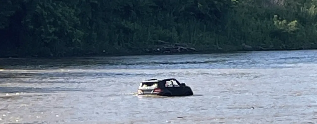 Toy vehicle mistaken for submerged car, in Big Blue River