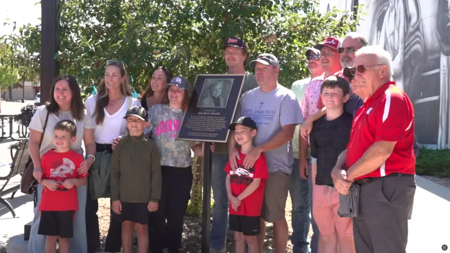 Family surprised in downtown Norfolk with plaque honoring late mother, Jan Merrill
