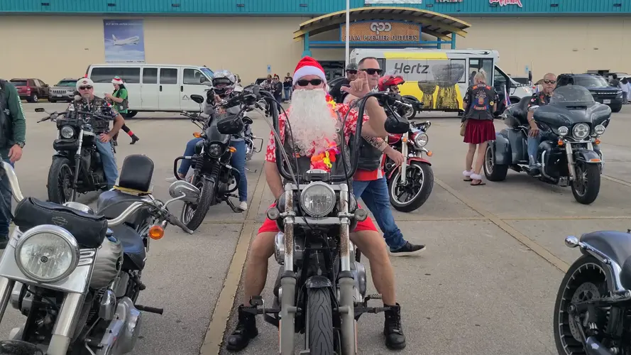 Island motorcycle clubs unite for annual "Christmas in July ride", bringing goods & hope to children