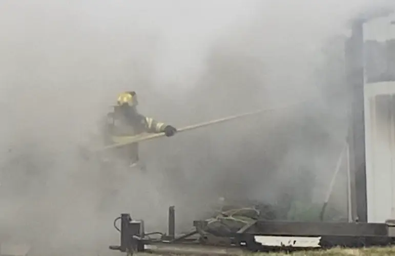 Firefighters extinguish fire in trailer house